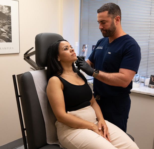 Dr. Bradley Glodny with a patient Park Avenue Dermatology